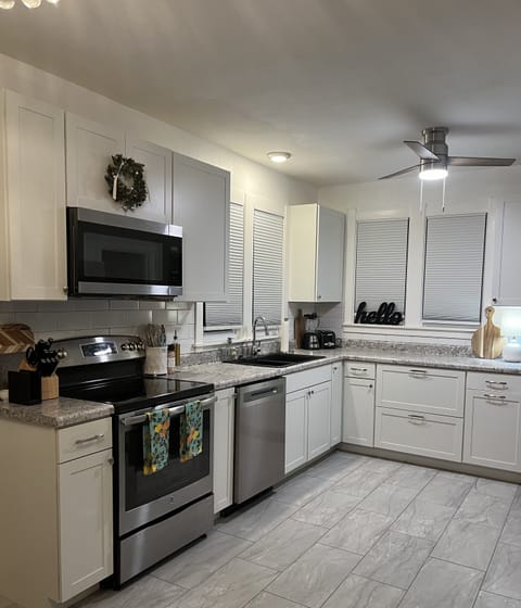 Fully stocked kitchen modern and new appliances.