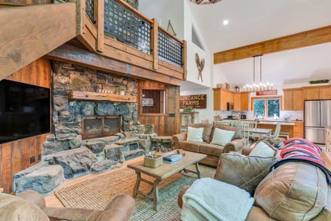 Living room with flat panel HDTV and gas fireplace.