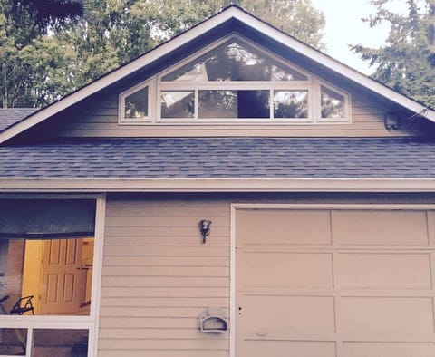 Outside of house showing bright loft area.