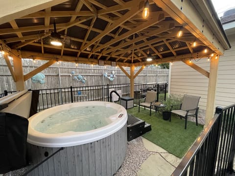 The perfect Hot Tub under a 12` x 16` gazebo, with two ceiling fans, great lighting, fully fenced in for safety.