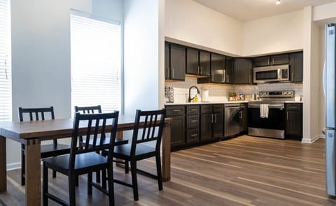 Open concept living and kitchen with lovely flooring