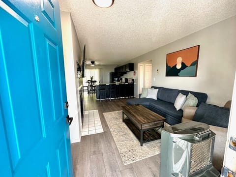 With an open floor plan leading to a sleek kitchen and dining area, this space is perfect for socializing, working remotely, or relaxing after a day of exploring. Conveniently located near top attractions, dining and entertainment.