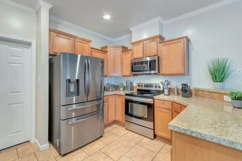 Kitchen. The door beside the refrigerator leads to the laundry room.