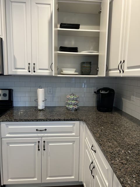 Keurig w/pods and provided eating utensils, plates, bowls