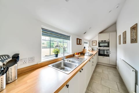 Lower Farm Cottage, Stalbridge Weston: The kitchen with view across the garden
