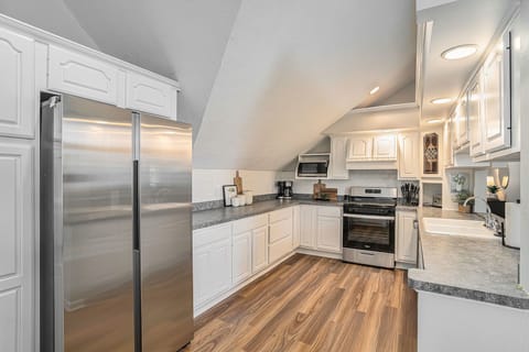 Modern Culinary Haven: Ample Storage and Gas Stove