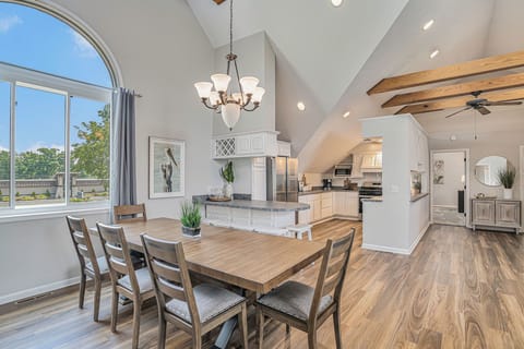 Abundant Natural Light Enhances Elegant Dining Ambiance