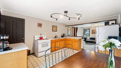 The upstairs kitchen offers a variety of amenities for short and long-term stays.