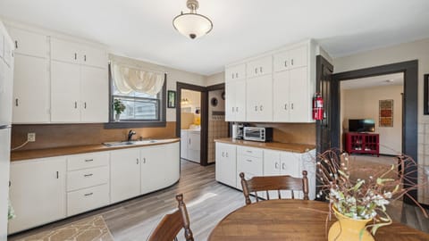 The kitchen is well-stocked with serving and dishware.