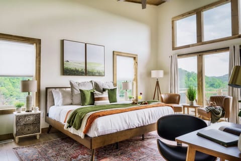 Our spacious bedroom beckons with an open embrace, inviting you into a realm of comfort and style.