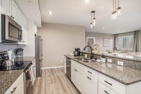 Our beach-themed unit features an open kitchen concept, perfect for modern living. Appliances and ample counter space make meal preparation is a breeze.