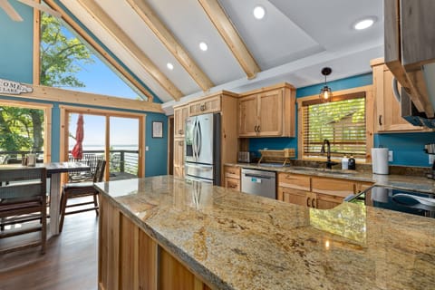 The view of our brand new kitchen as you get to the top of the stairs. Hi, Gull Lake!