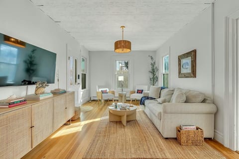 Living Room featuring Queen pull out couch and 55 inch TV
