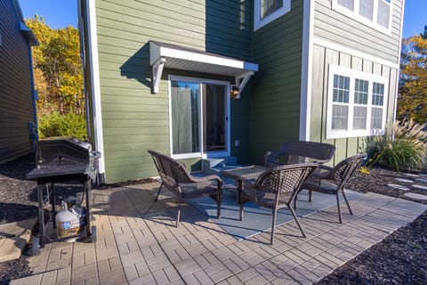 Enjoy the private outdoor patio, complete with comfortable seating and a gas grill – ideal for relaxing, dining outside, or unwinding after a day at the beach.
