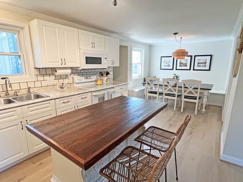 Seating for the entire family between the  kitchen island and large dining table