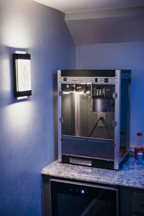 Theater room bar with wine cooler, bev cooler, popcorn machine, stereo & pizza pizzaz!