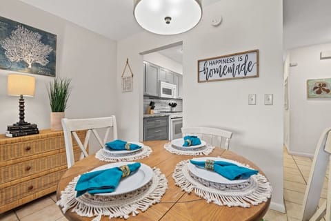A charming dining table is situated in the living area with convenient access to the kitchen.