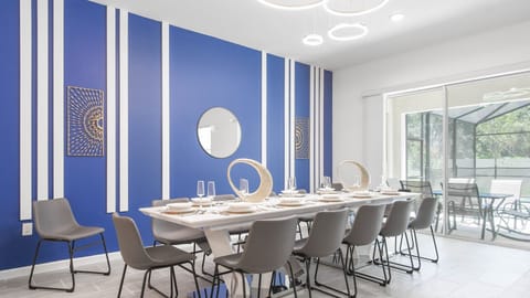 Host memorable family dinners in this spacious dining area, complete with stylish decor and ample seating for everyone to enjoy.