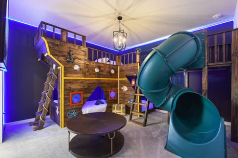 Epic pirate-themed kids room with slide, bunks, and adventure around every corner