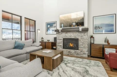Cozy fireplace, comfy sectional sofa and leather side chair