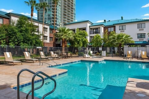 Bask poolside with palm views and plenty of loungers.