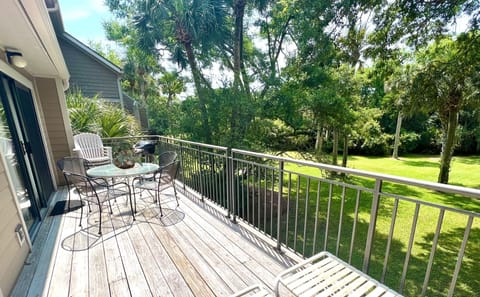 Your private deck offers a gas grill, dining set, and beautiful views of the lush, wooded landscape.