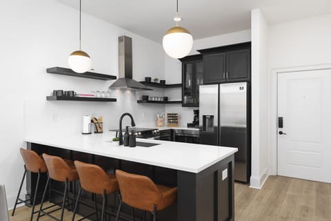 Seating for 4 at the kitchen counter. The kitchen is fully-stocked and ideal for anyone who enjoys cooking & convening.