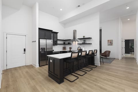 The kitchen is fully stocked with high-end appliances and every utensil, dish, and spice you might need to make a meal. Seating for four available at the counter.