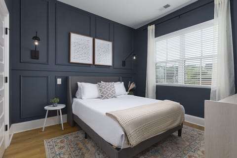 Comfortable Queen bed in the primary bedroom with an ensuite bathroom, lots of natural light, and plenty of closet space.