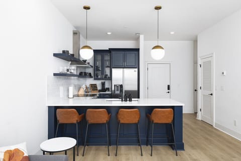 Fully stocked kitchen, herbs & spices, and high-end appliances for all your cooking needs. Seating for four at the kitchen counter.