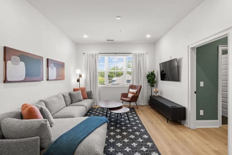 Relaxing living room with room-darkening shades and a Smart TV  with all the streaming apps.