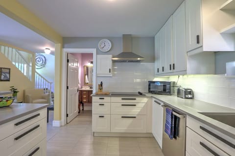 Modern kitchen with sleek counters and new stainless appliances