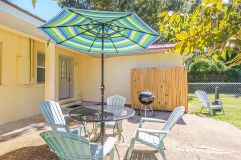 Private patio space with grill and seating area