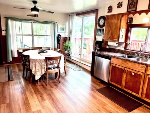 Other view of kitchen and dining