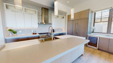 Share the meal prep or enjoy a chat at the extended kitchen island.
