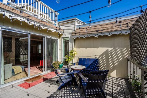 Have a snack and beverage on the sunny back porch. (Outdoor shower and BBQ too!)