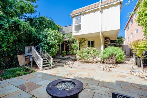 Enjoy the fire pit in the professionally landscaped backyard.