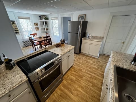 The large open kitchen and dining area are this homes shining gem, a wonderful place to spend time sharing a meal during your getaway. 