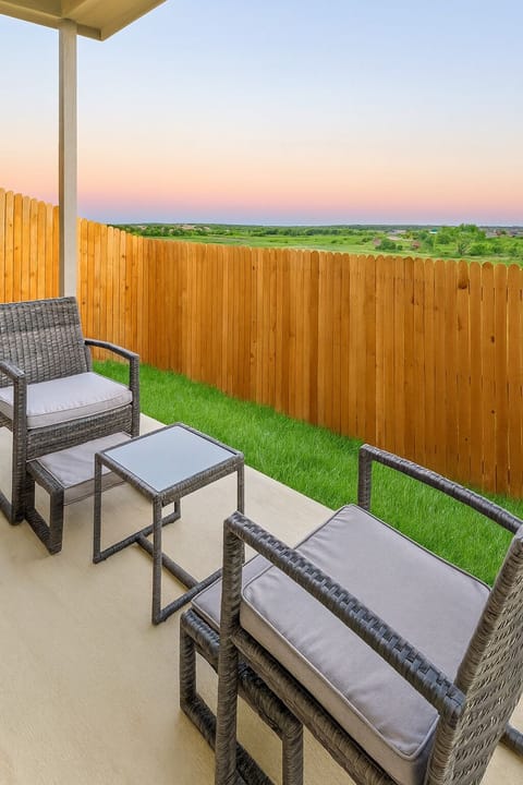 Private back yard with a beautiful view of the adjacent grassy field. 