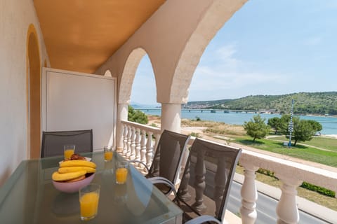 Balcony with sitting area & sea view