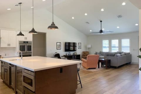 Dimmable overhead lights in kitchen and living area.