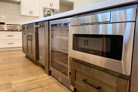 The 10' island contains microwave, icemaker, beverage cooler, and trash bin.