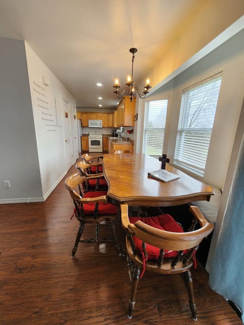 There is easily seating for 9 around the table. Add more tables & chairs for 20