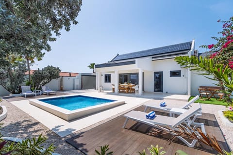 Experience a luxurious vacation. Take a dip in this enthralling outdoor pool.