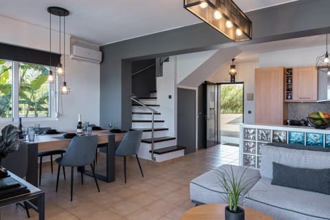 Main entrance of Per Mare, with a open plan of the kitchen and living room space