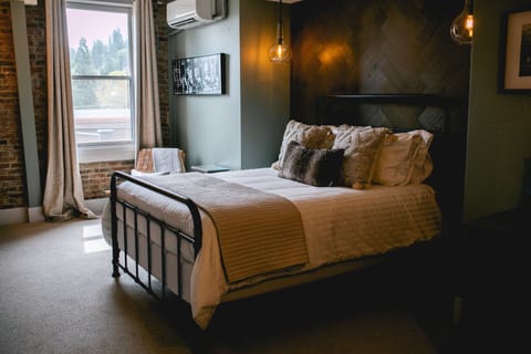 Relax in elegance and comfort with our Queen Suite, a perfect blend of style and tranquility for your ultimate retreat.