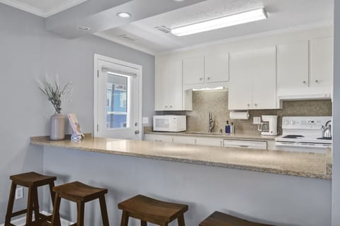 Additional bar seating so you can chat with the cook; Unit A