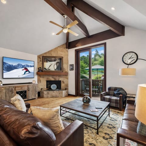 Sink into rich leather seating by your stone fireplace while mountain breezes flow through your private balcony doors.
