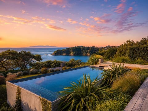 Pool sits on the edge of a cliff overlooking the ocean 