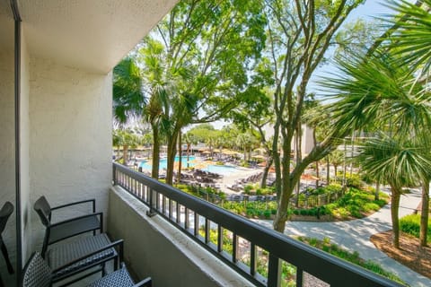 Sip morning coffee overlooking the pool and lush palms.